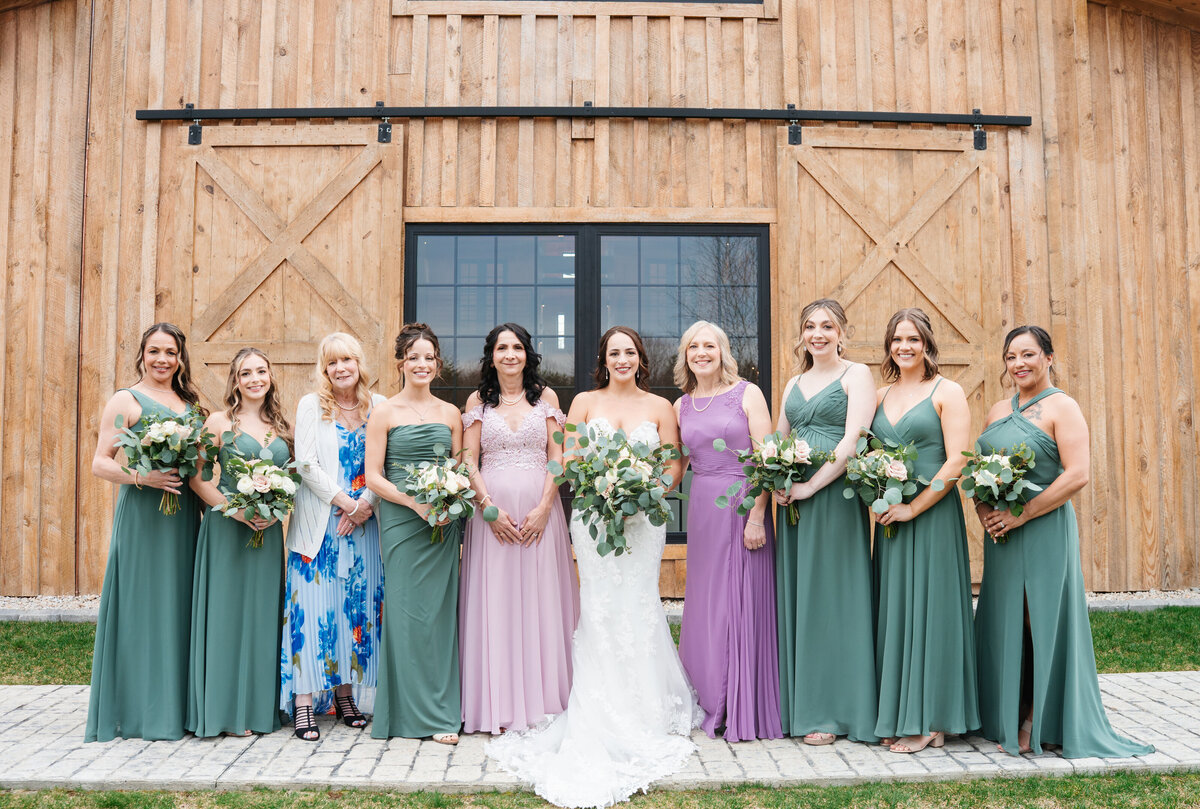 Bride and groom laughing together during wedding day portraits