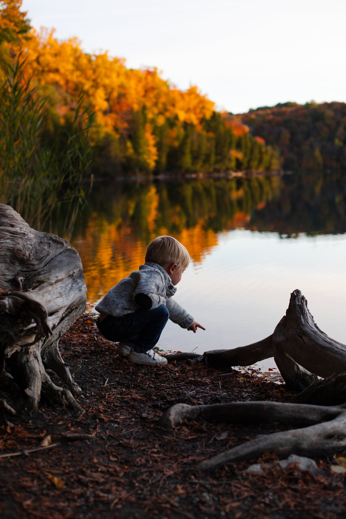 Syracuse landscape with little boy neat water