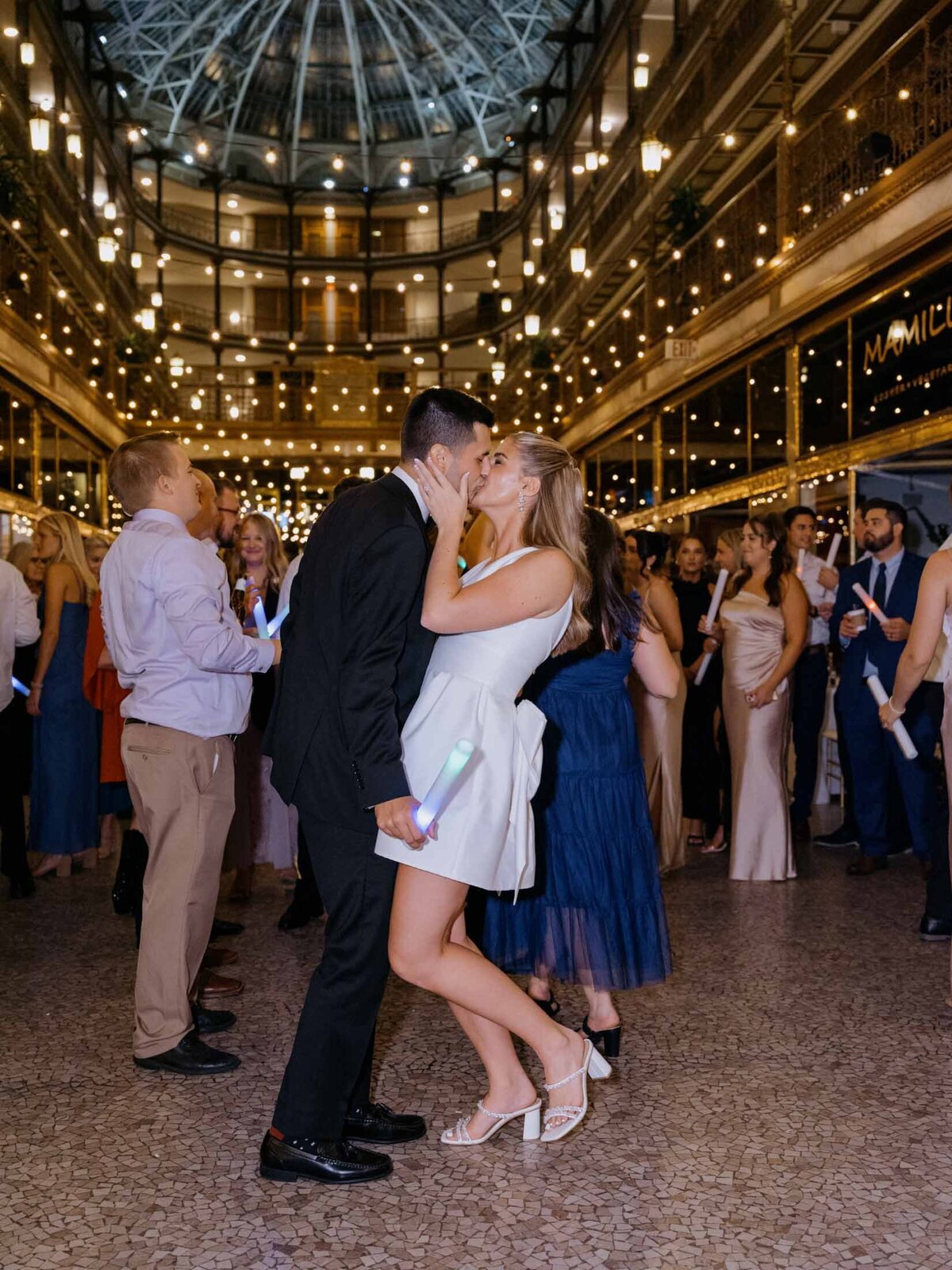 Newlyweds dancing beneath the skylight at The Arcade