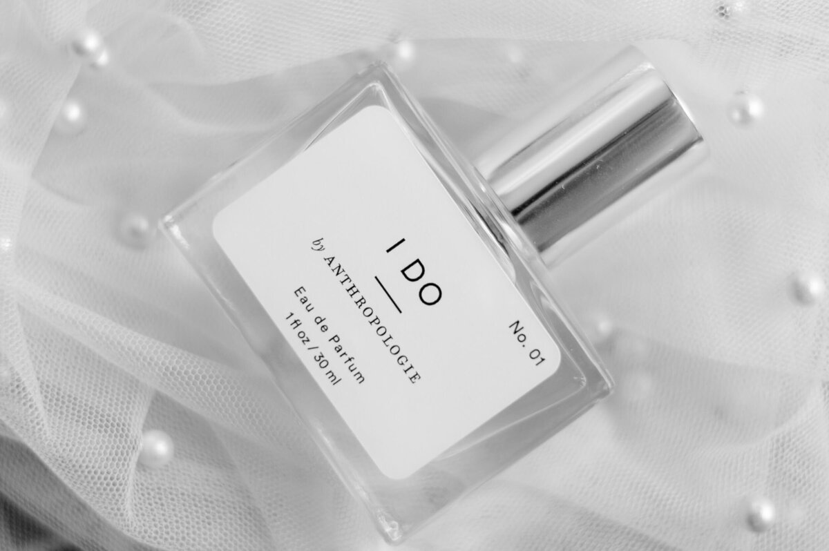 Bridal perfume bottle styled on lace, captured by timeless Pittsburgh wedding photographer Bree Stewart of LLP.
