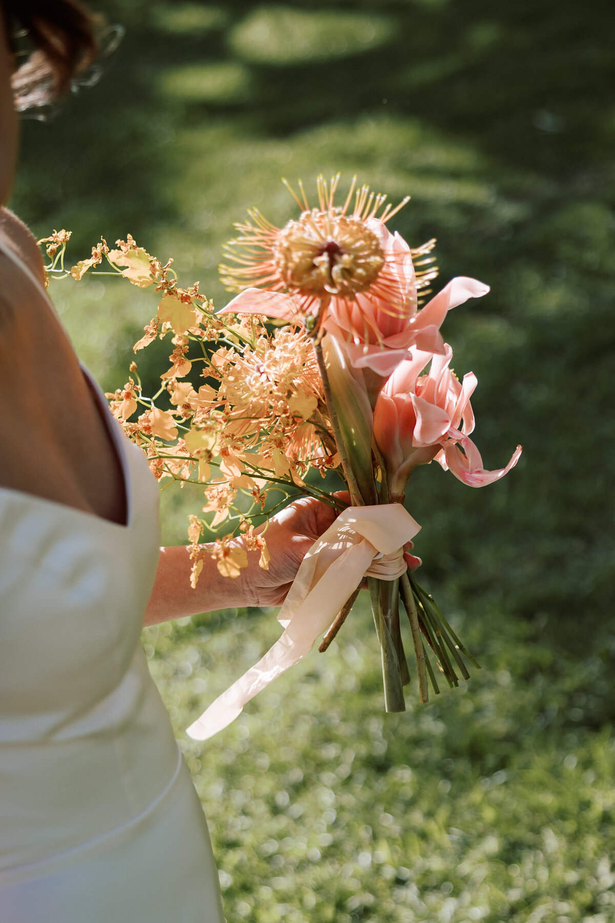 Tropical bouquet captured on film in a candid, documentary wedding photography style — Carmel wedding photography by Kate Winters Photography.