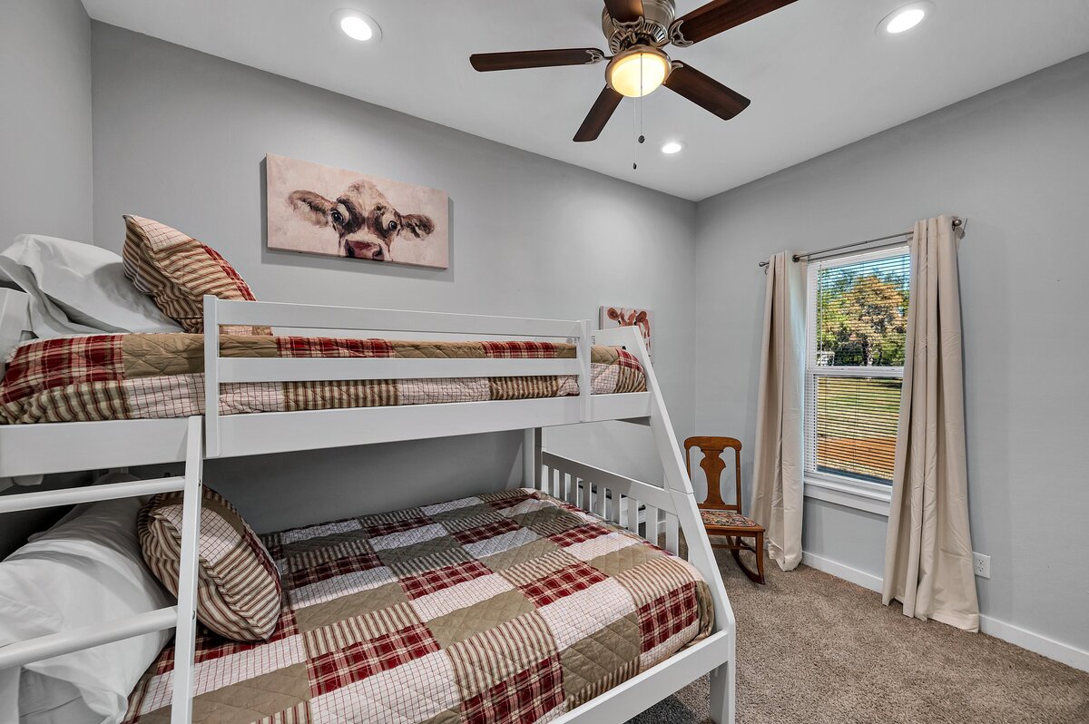 Bunk beds to sleep 3 in this 7-bedroom, 5-bathroom farmhouse that sleeps 21 on a secluded acreage just 15 minutes from downtown Waco, TX