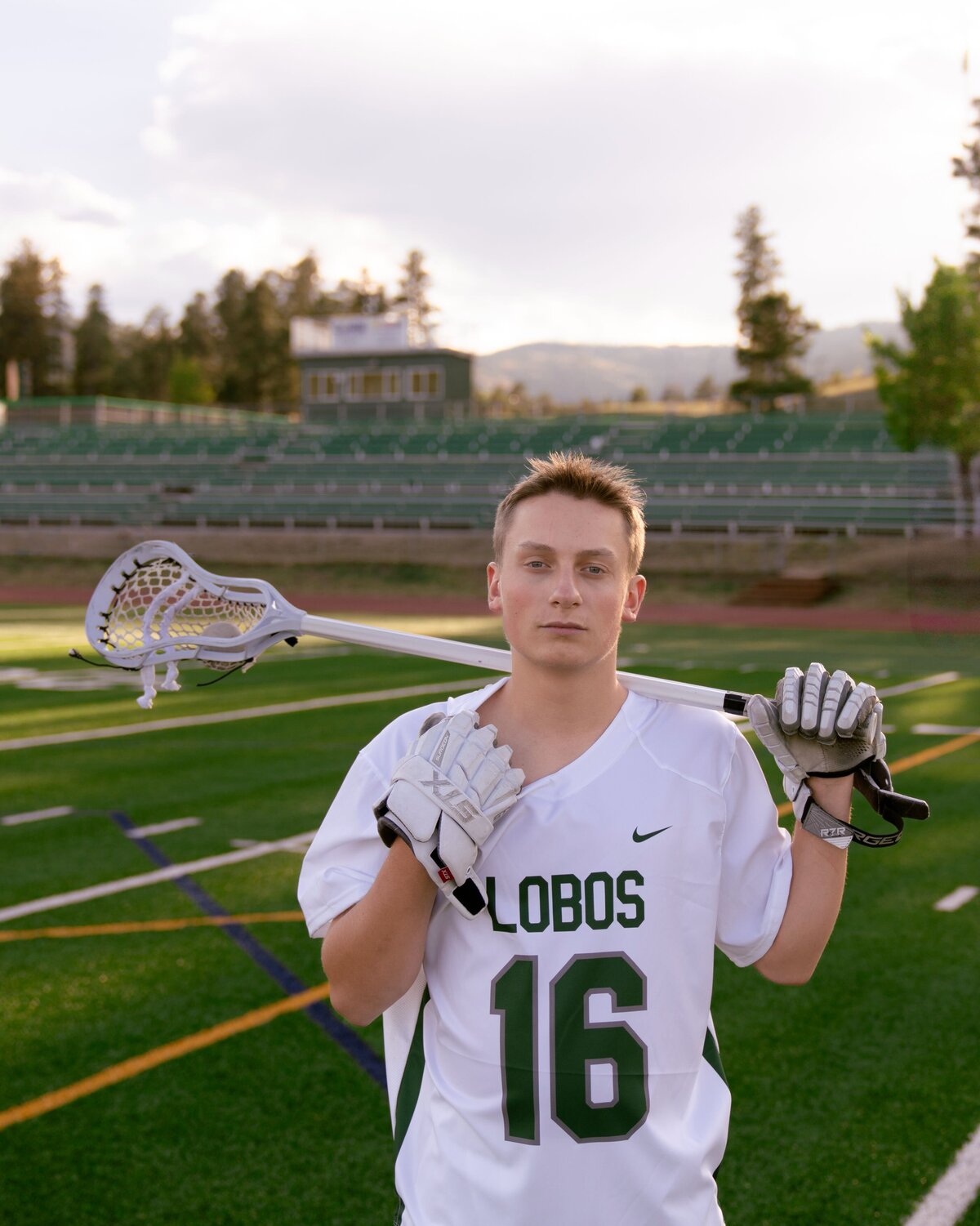 denver senior photography - boy holding lacross stick