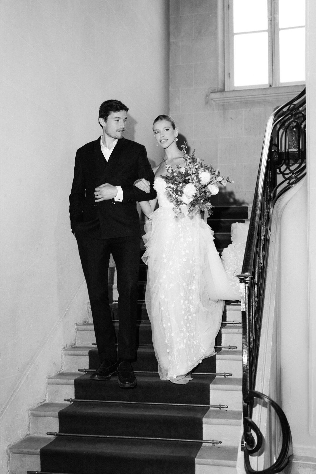 High-end wedding at a French chateau near Paris with a mering tower wedding cake.