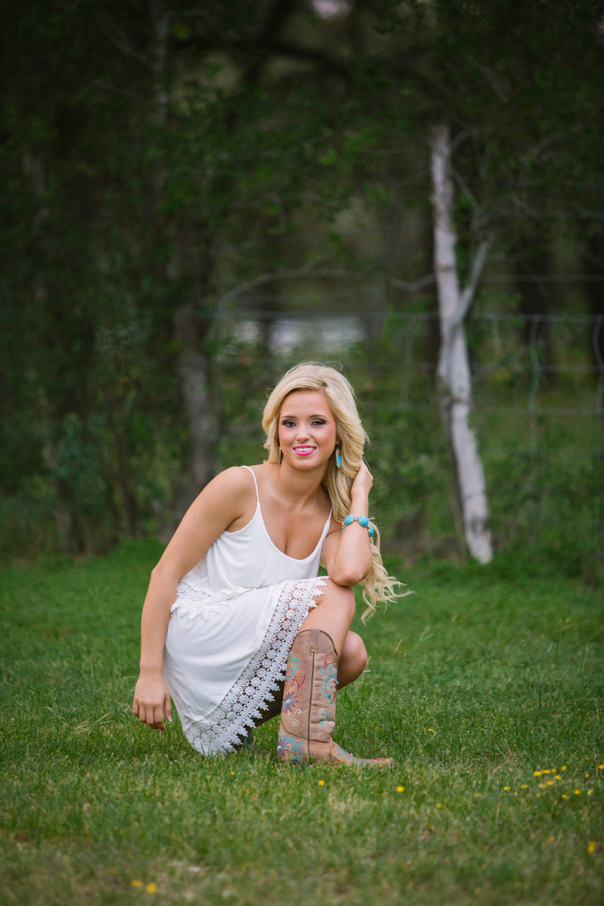 high school senior session of girl posing in boots by San Antonio senior photographer