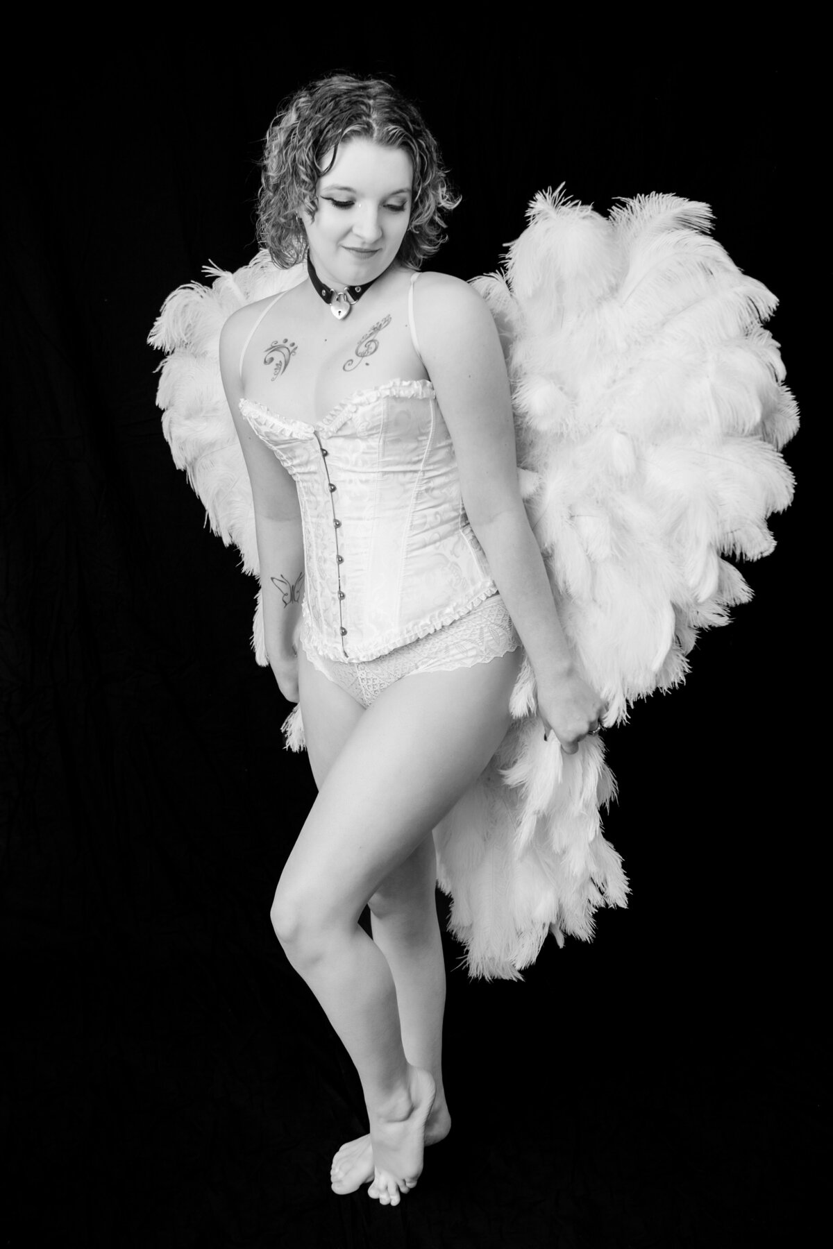 Boudoir photo with angel wings