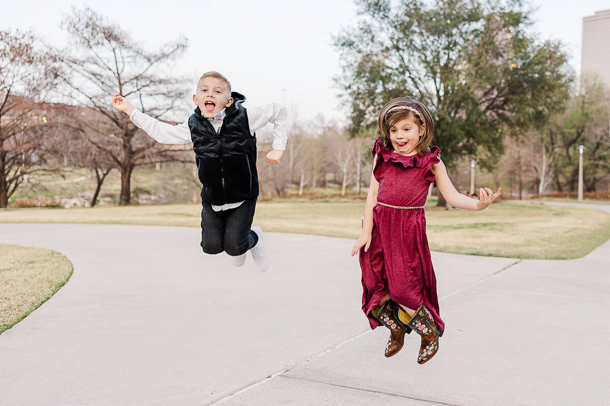 Brother and sister jumping