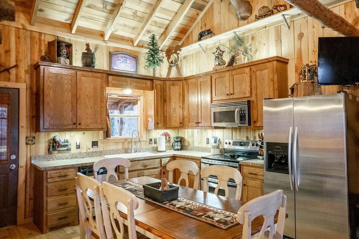 Large family kitchen inside cozy rustic cabin