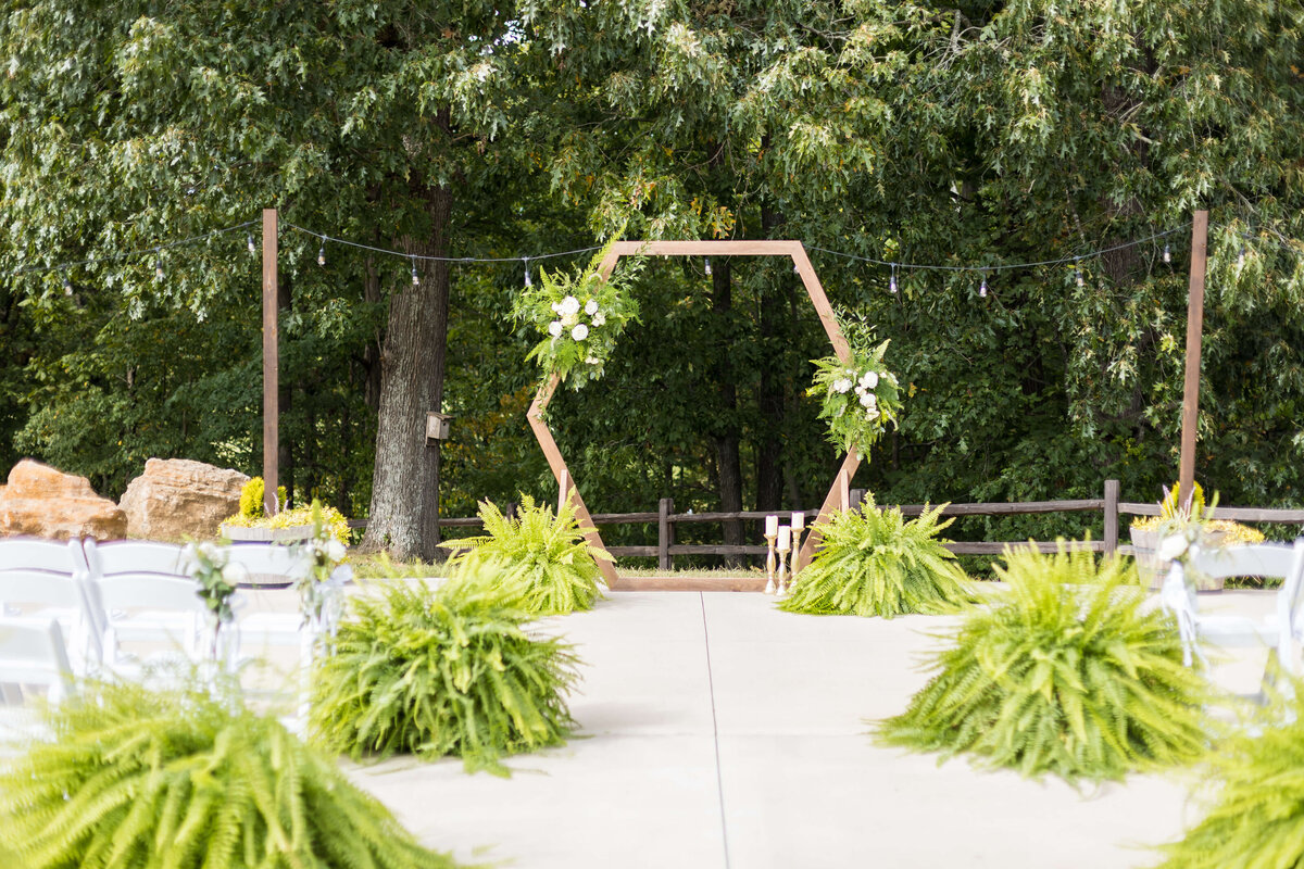 Wedding ceremony set up with hexagon centerpiece with greenery at wedding at Mahr Park, Tennessee
