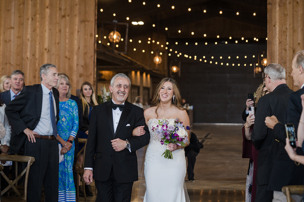 Bride and dad walk down aisle