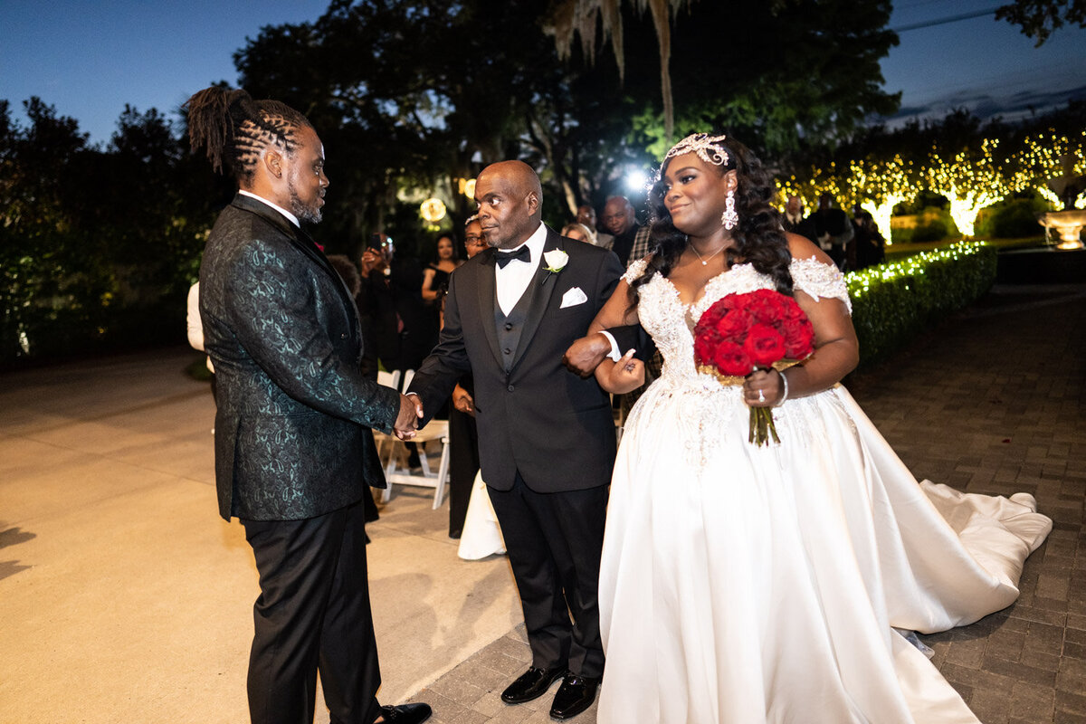 Bride's father shakes hands with the groom