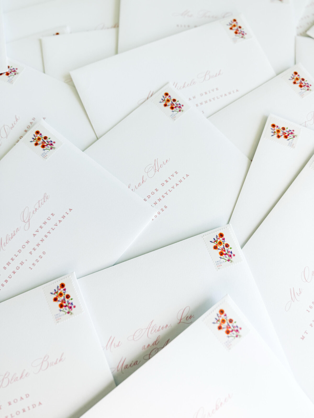 white envelopes with floral postage