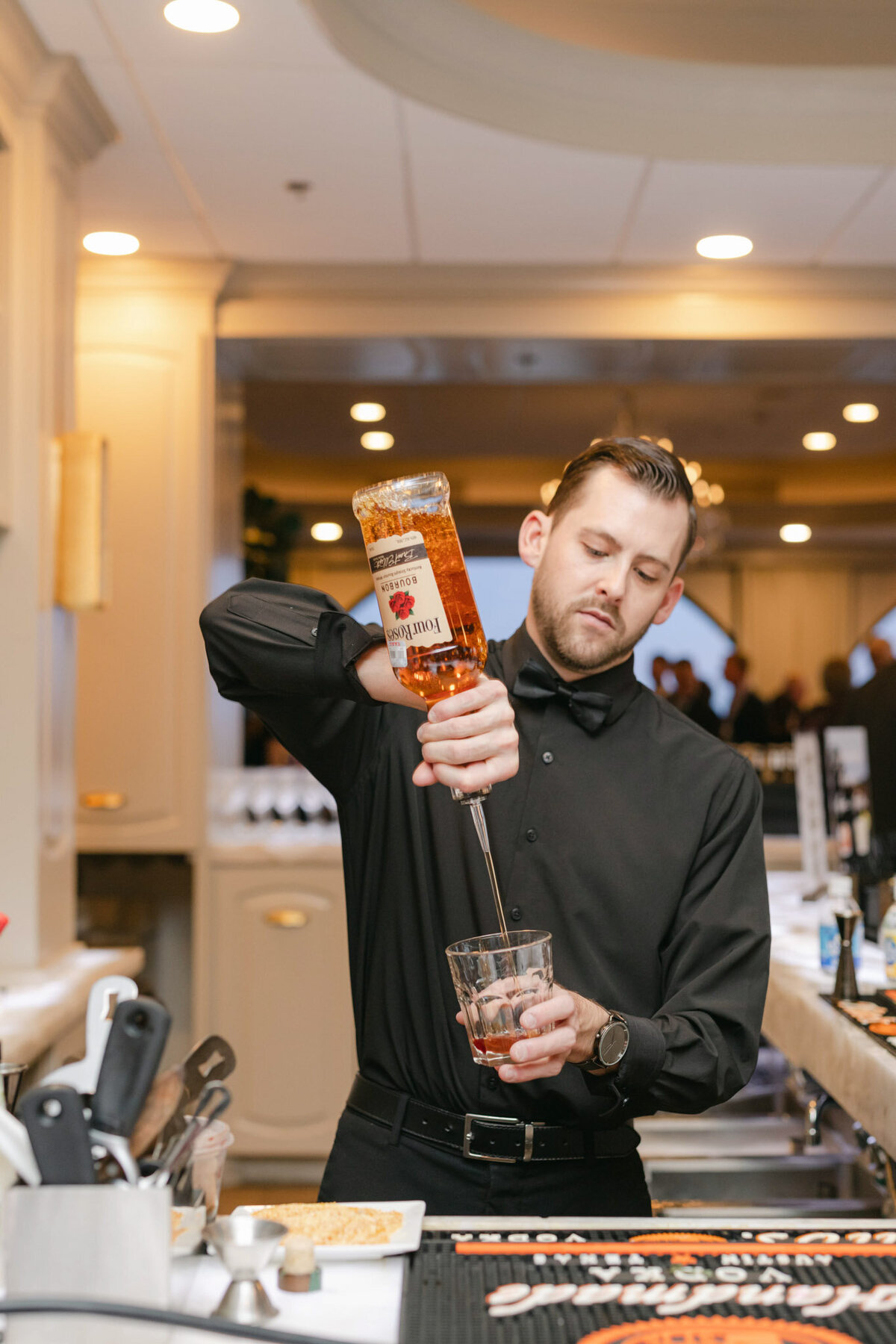 bartender pouring drink at texas wedding