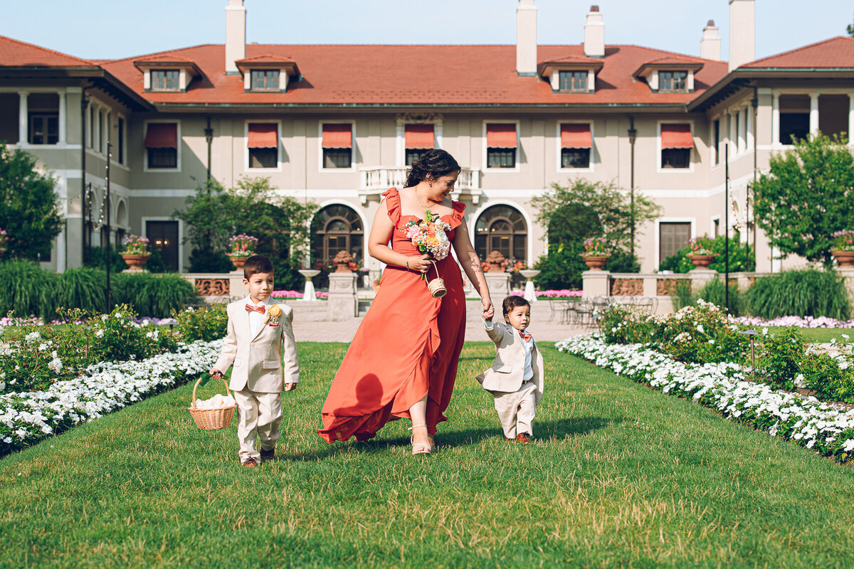 Ring bearers walk down the aisle at Armour House in Lake Forest