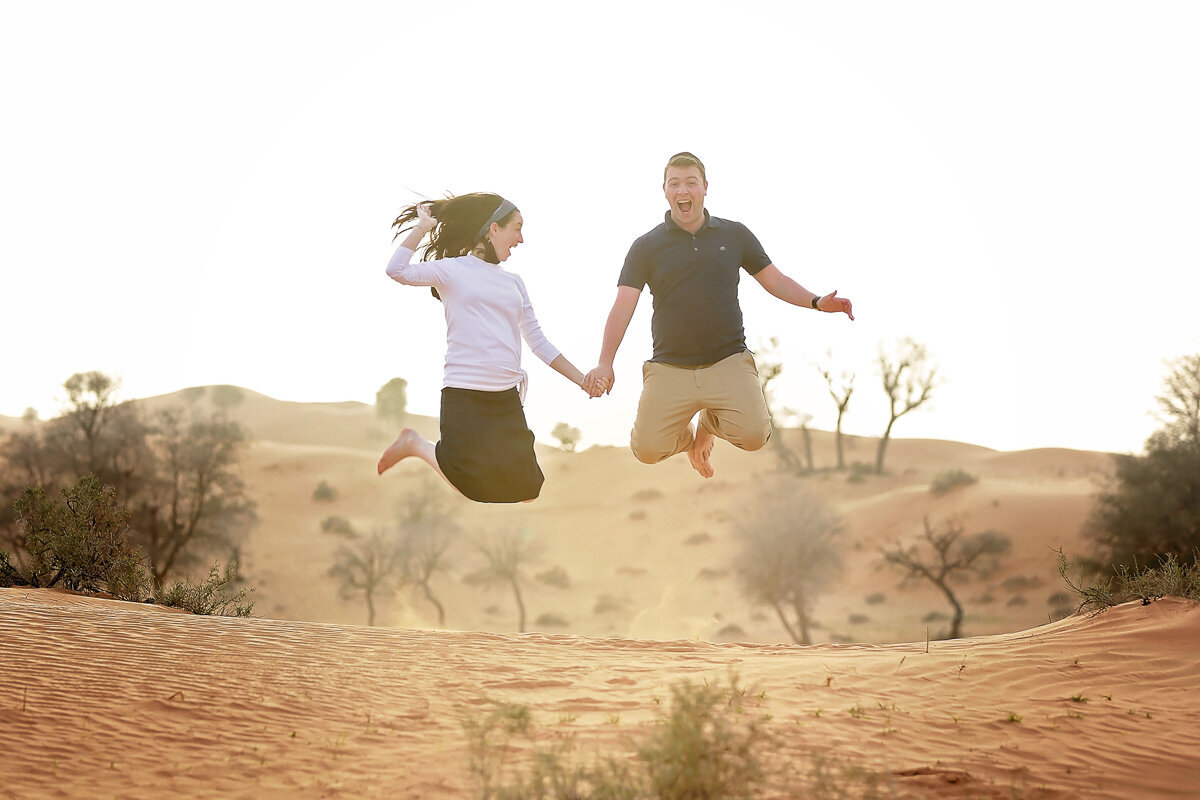 jewish-couple-jumping-desert