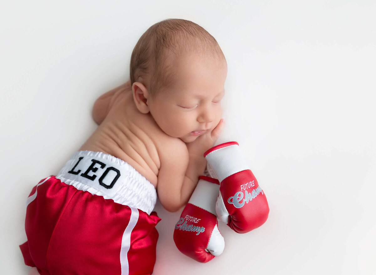 Baby boy newborn photos little boxer captured in a Manhattan newborn photography session 