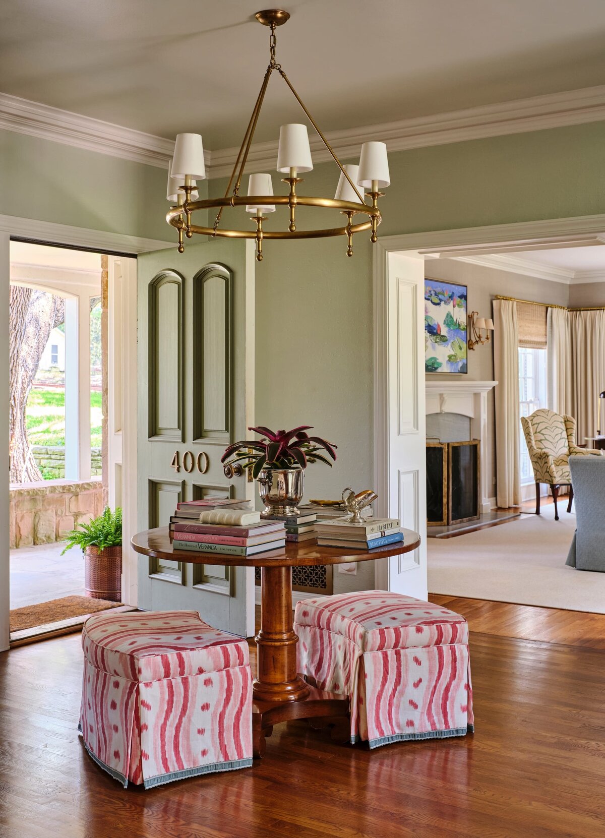 the keeping room interiors morningside entryway round table with books and hanging light fixture