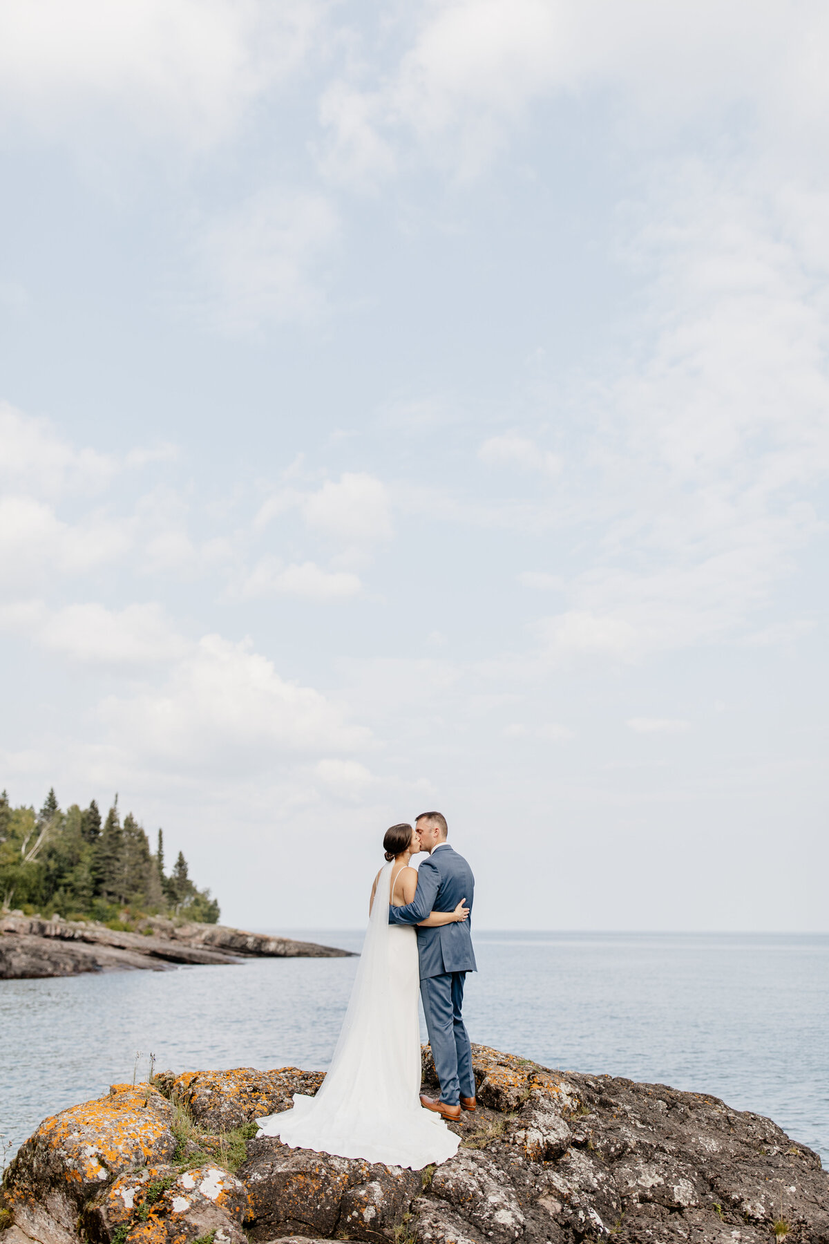 Wedding photography in MN, captured on the North Shore, featuring a couple enjoying a scenic moment together