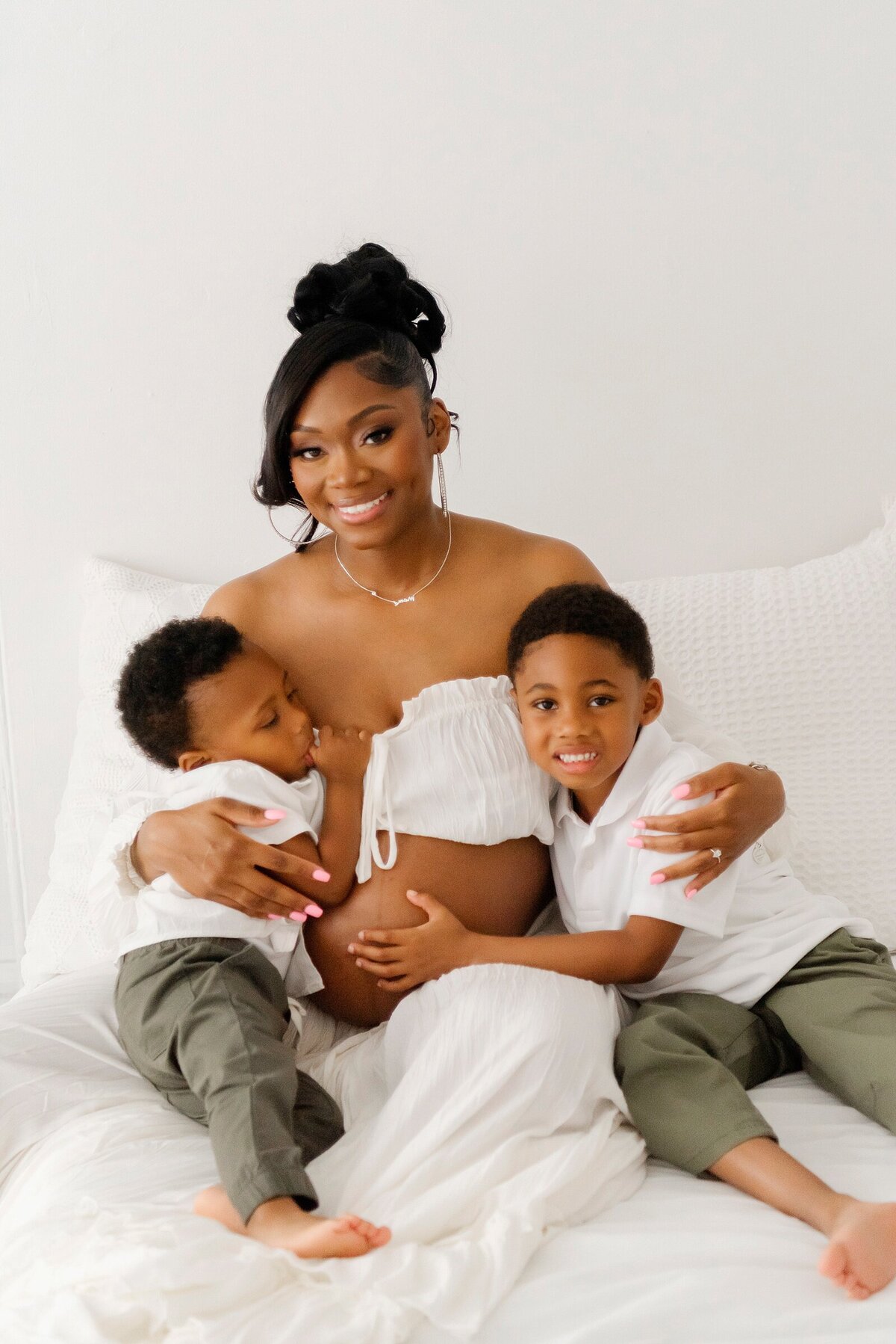 expecting mom with two boys by maternity photographer boston ma​