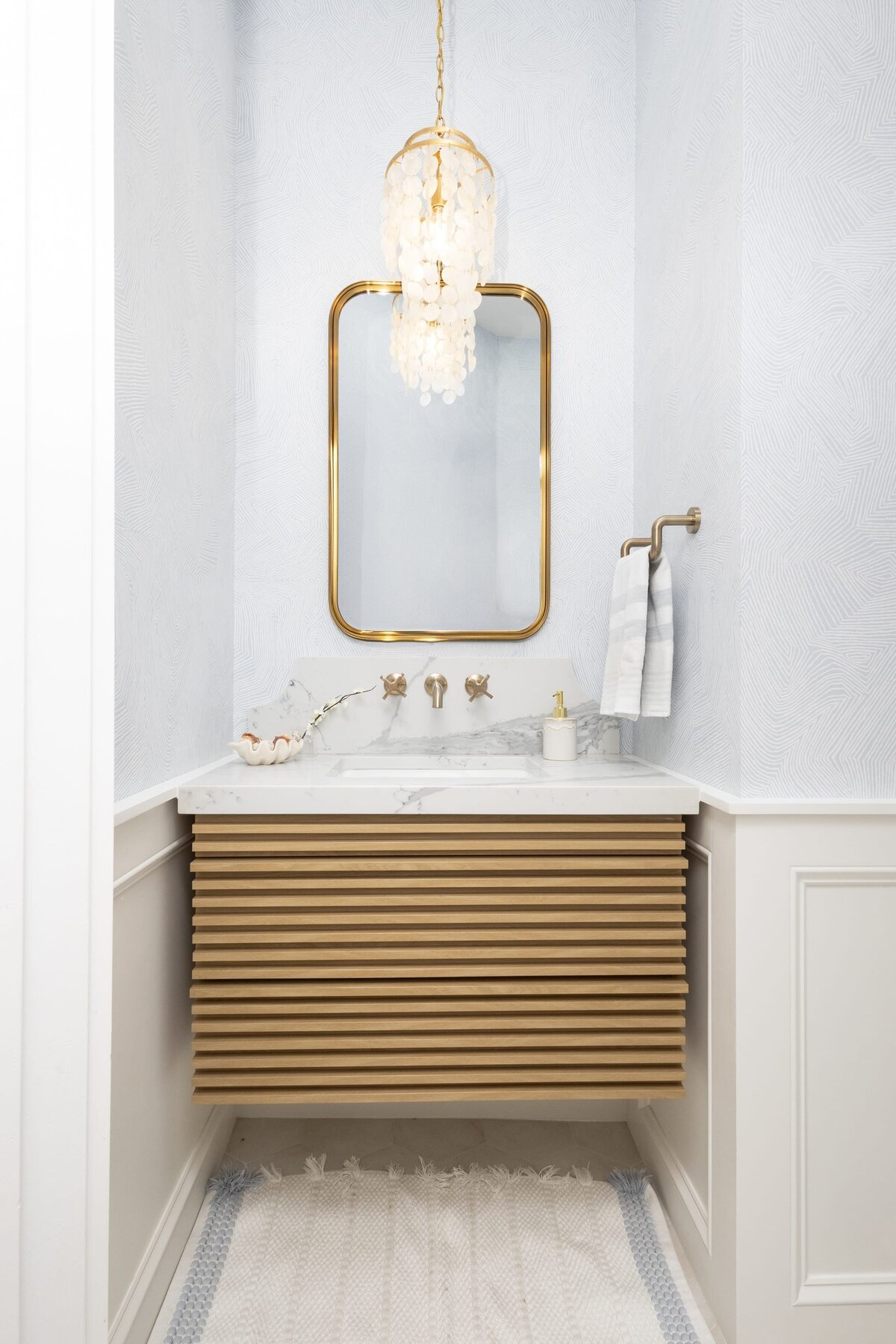 dewine design orlando interior designer contemporary coastal powder bathroom gold mirror with wallpaper