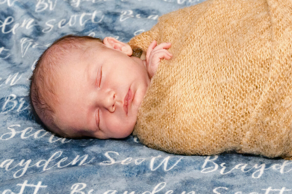baby on blanket with his name on it