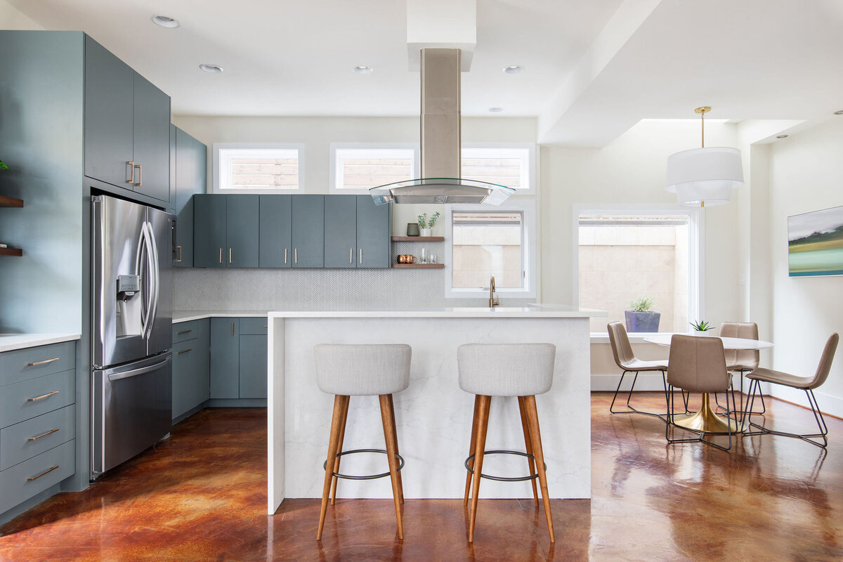 hello-home-Contemporary-Kitchen-Blue-Cabinets-Brass-Hardware-Stainless-Steel-Appliances-Polished-Concrete-Floor-Kitchen-Remodel-quartz-waterfall-island-Austin-TX-1