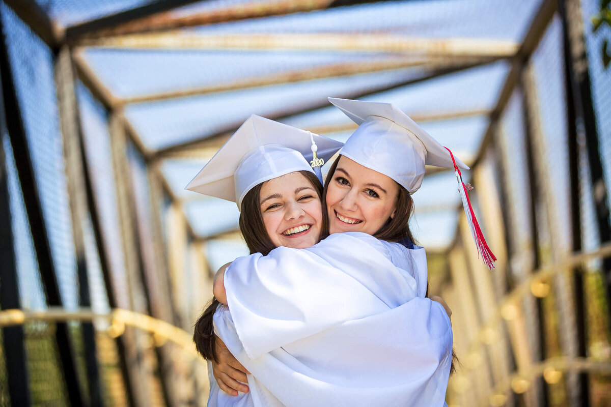 northern-kentucky-high-school-senior-friends-hugging-cap-and-gown