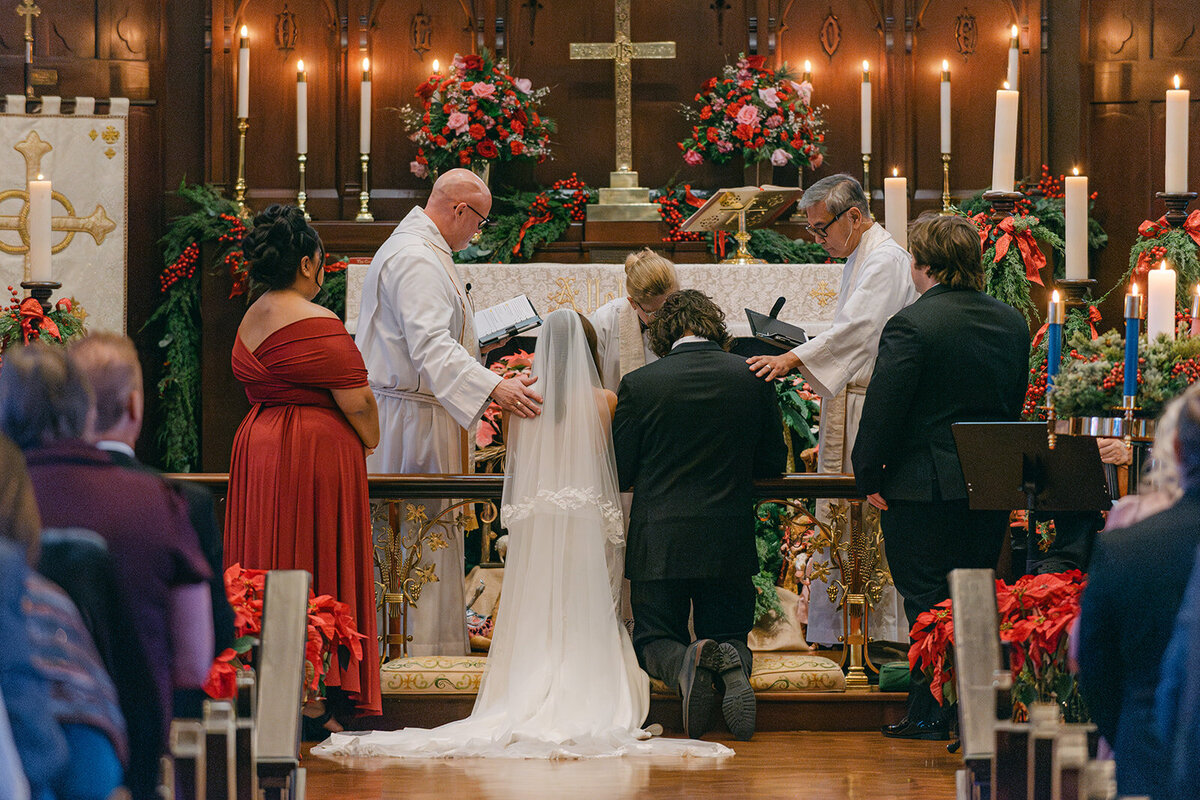 Bride and groom hugging guests post-ceremony in ornate Texas wedding church