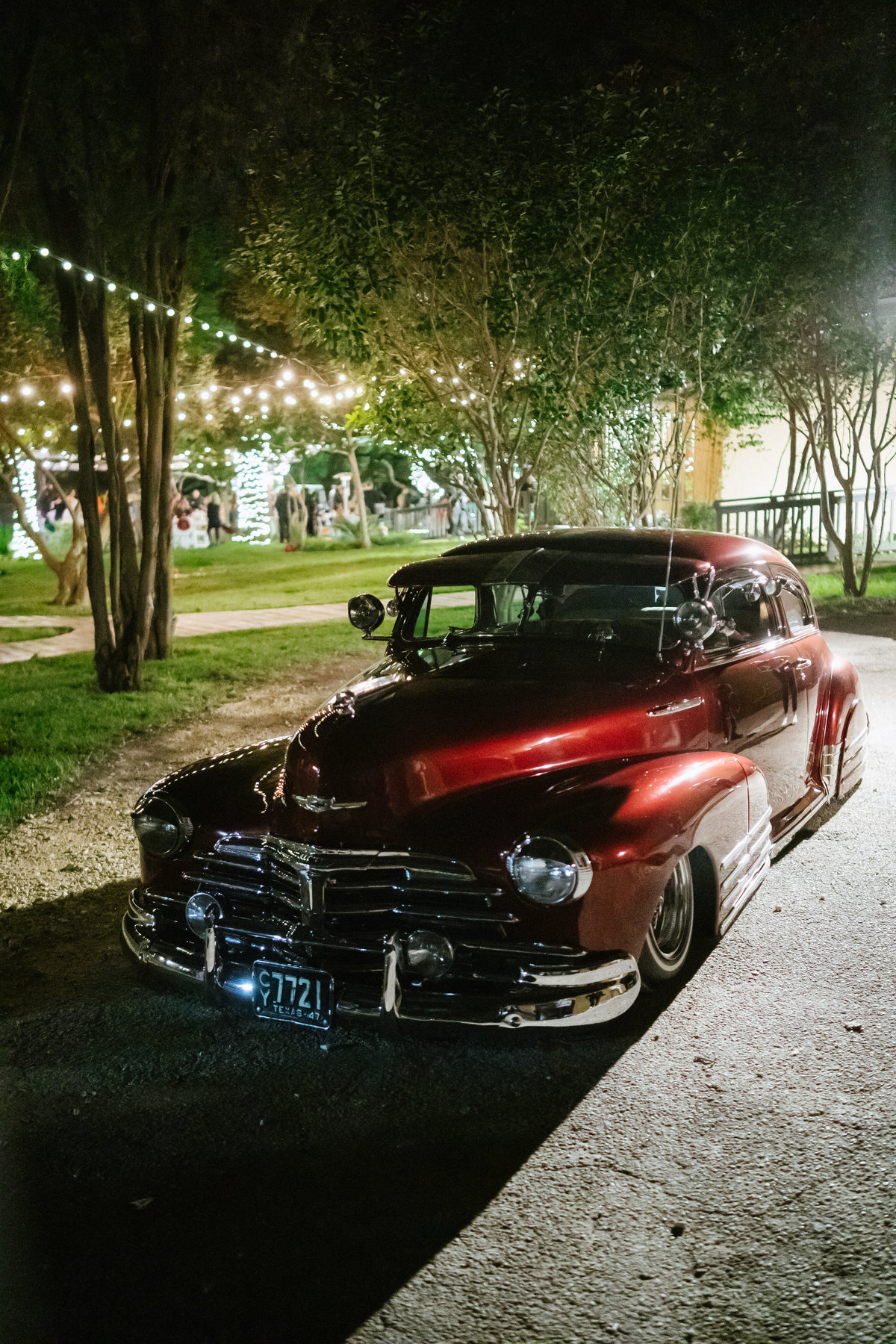 vintage classic getaway car at grand exit of bride and groom at wedding at The Gardens at Old Town Helotes Texas Hill Country