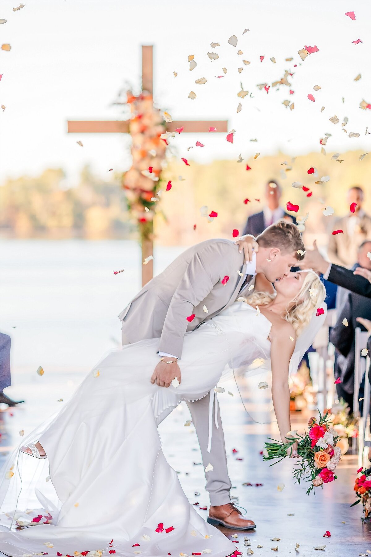 Bride and groom dip kiss after ceremony | Image by Amanda Horne photography