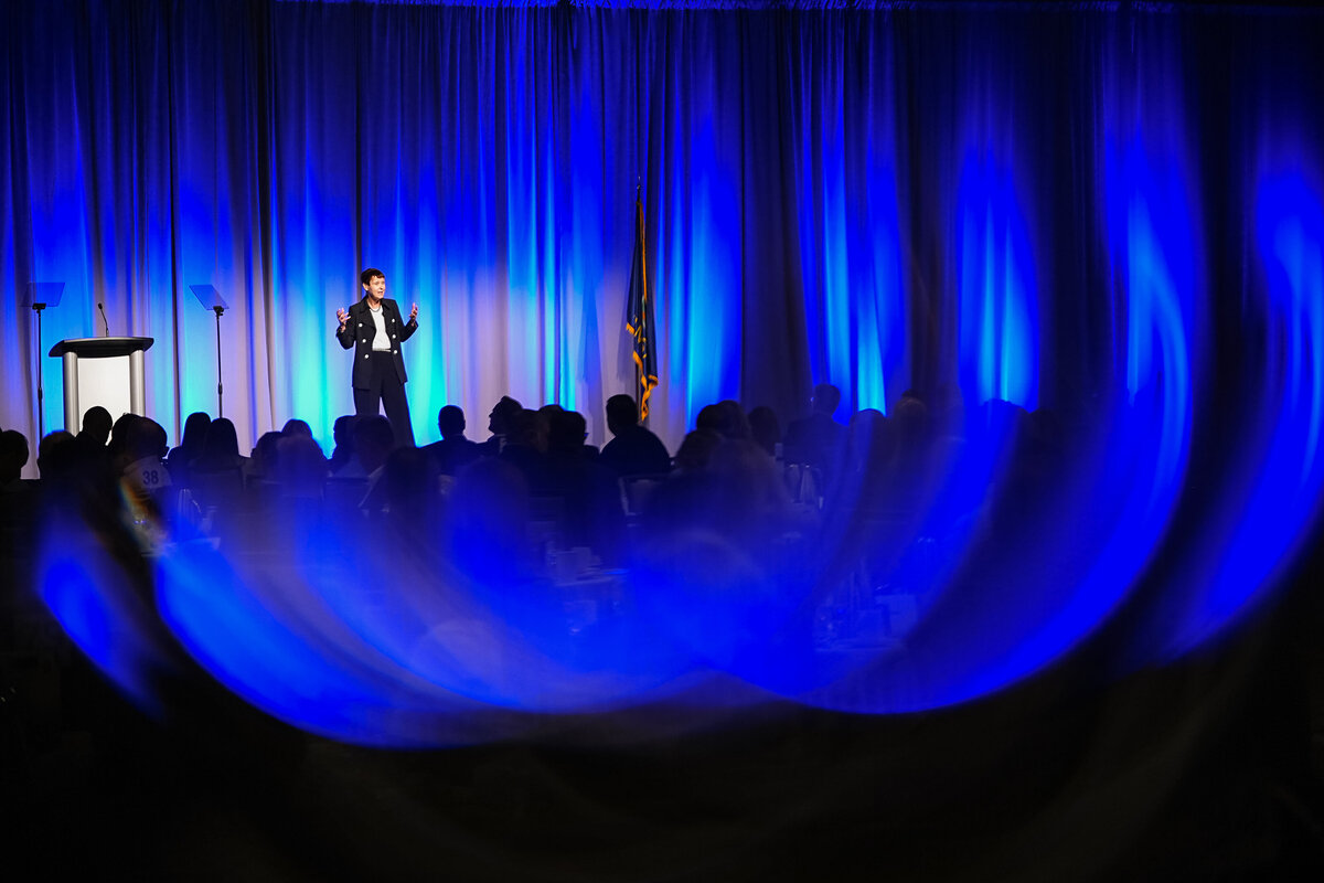 kansas-city-event-photography-0036-blue-curtain-stage-with-speakers