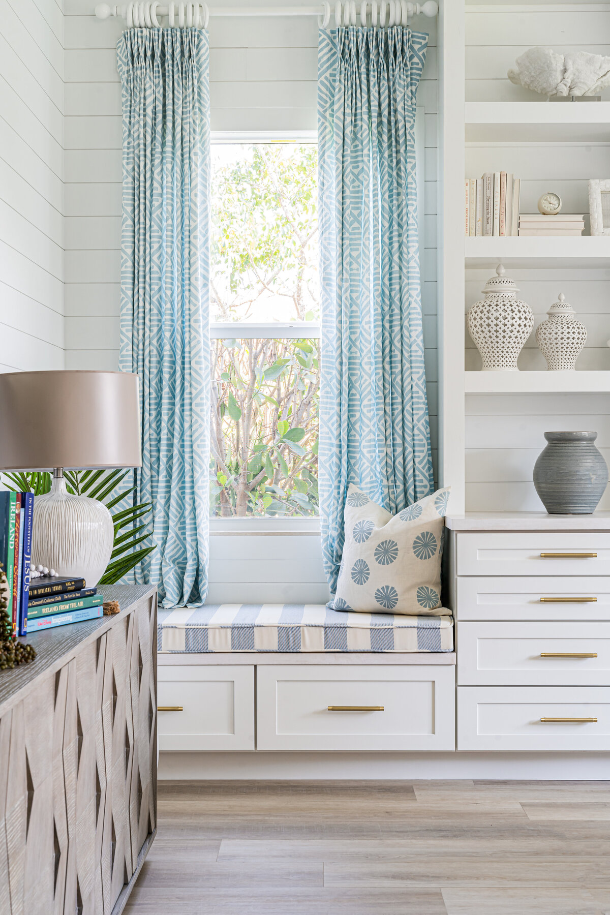coastal home family room reading nook bench seat and styling by Island Home Interiors Lake Nona