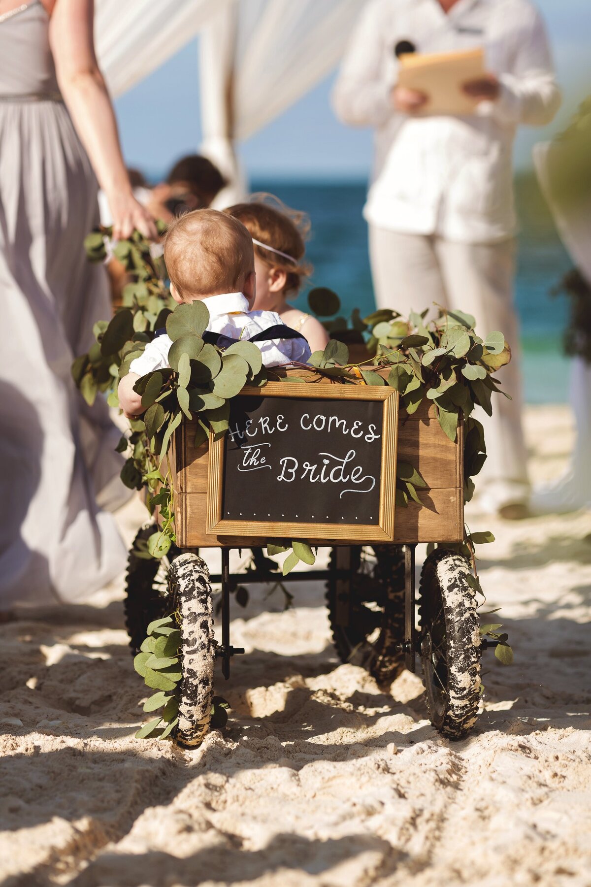 Close up of flower girl and ring bearer in wagon