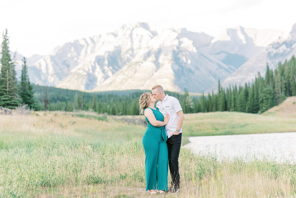 Beautiful couple standing in the gorgeous mountains of Alberta outside of Edmonton.