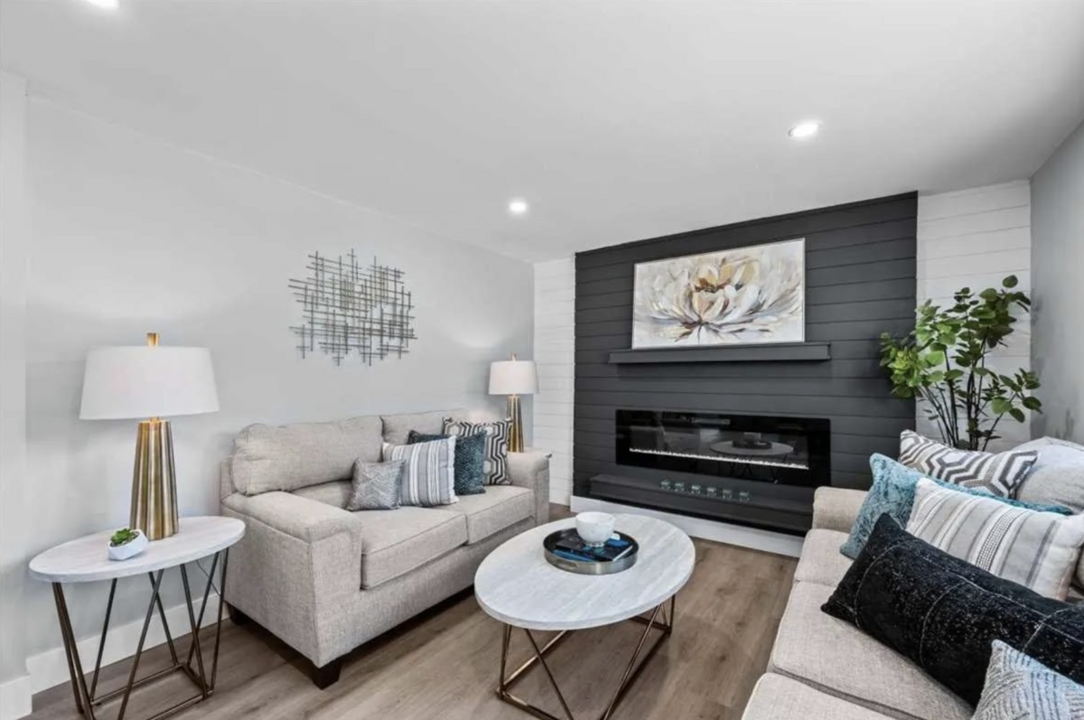 living room with black fireplace