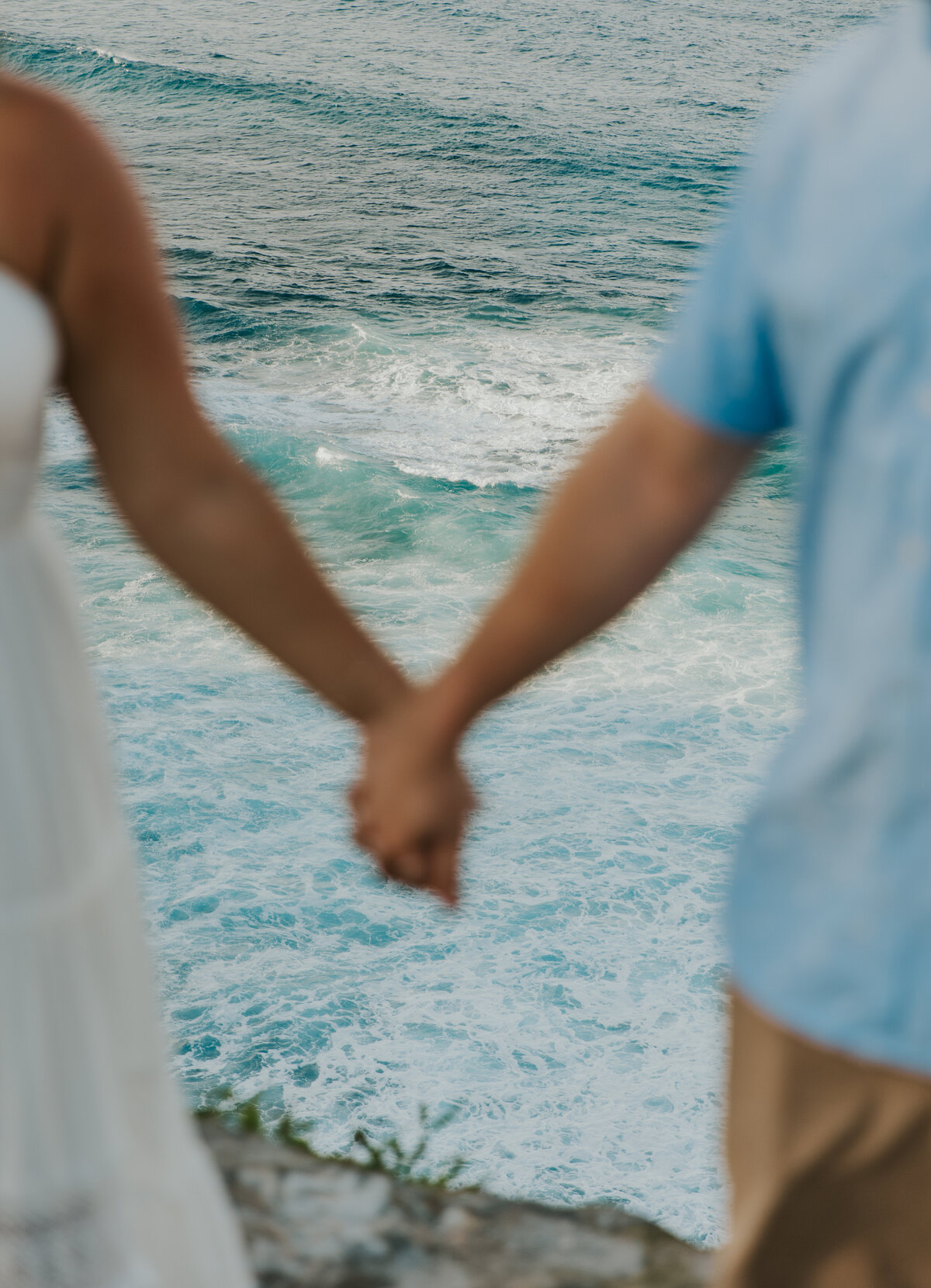 Hawaii Engagement Photographer captures couple holding hands at beach