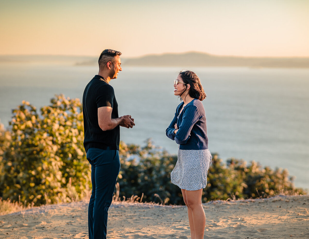 About to propose to his new fiance, unaware, in Discovery Park, Seattle. Photographed by Maë Lans Photography