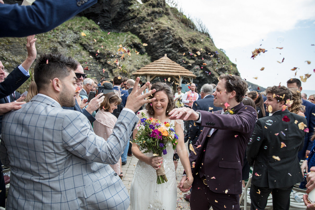 Confetti photo after wedding at Tunnels Beaches Devon