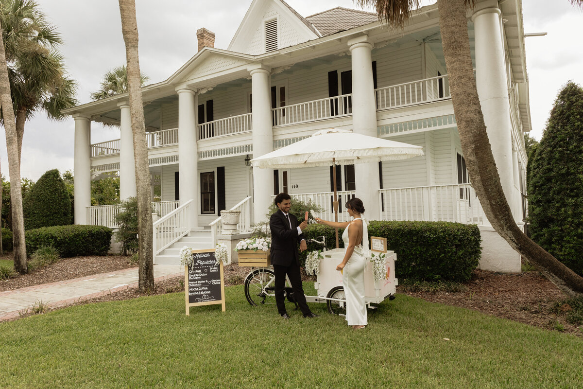 Charming pastel popsicle cart at a Florida wedding reception at The Palm Mansion