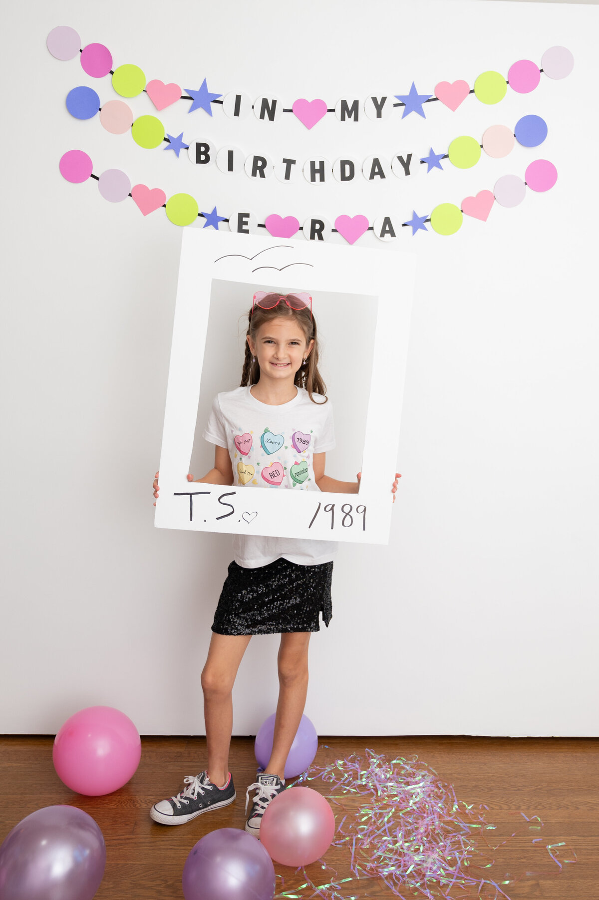 girl holding polaroid taking selfie in my birthday era party