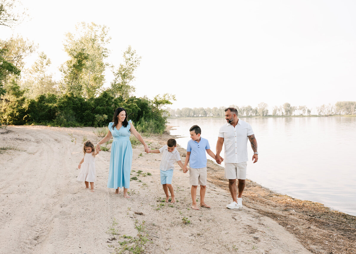 Family photo of mom an dad with children at Presque Isle in Erie Pa
