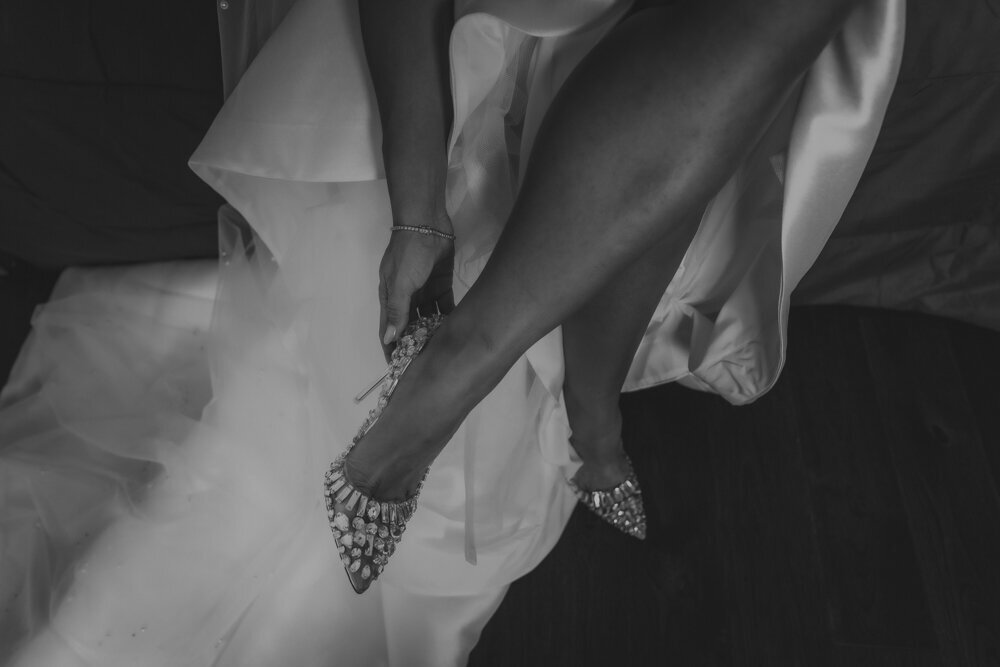 Bride Putting on Shoes