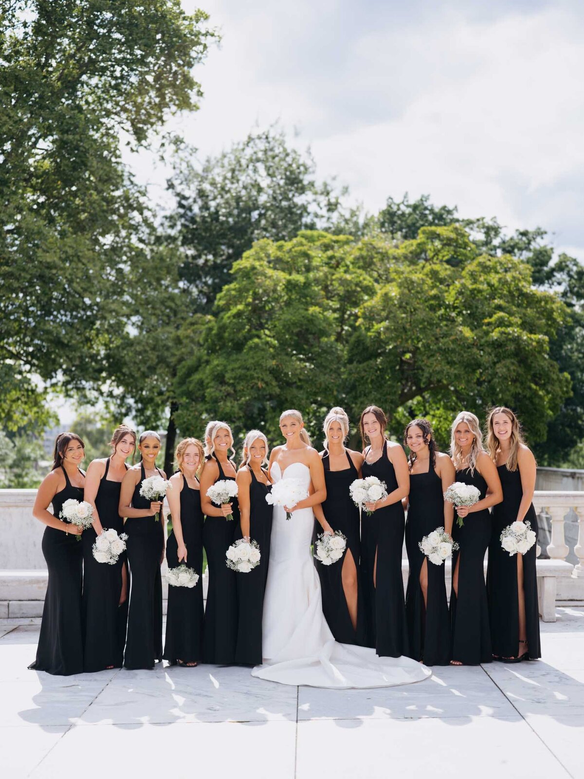 Bride with bridesmaids in black dresses at Cleveland Art Museum