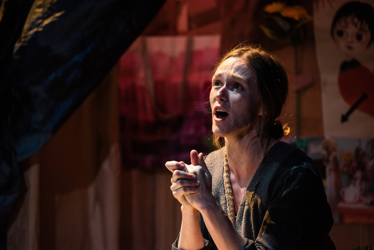 A person singing during a play