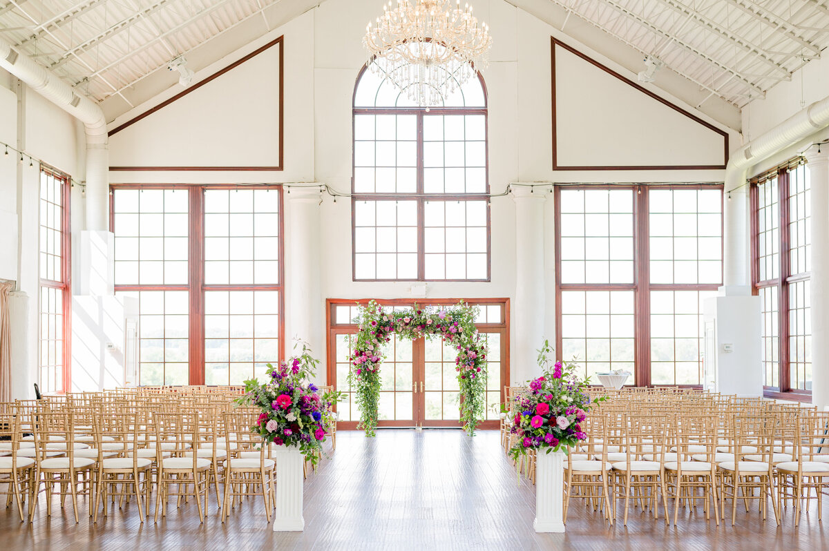 Elegant wedding ceremony florals, arranged with deutzia blossoms and jessamine vines cut from the garden. Custom floral design for Eastern Shore wedding venues near Kent Island, MD, Tilghman Island, MD and Chestertown, MD.