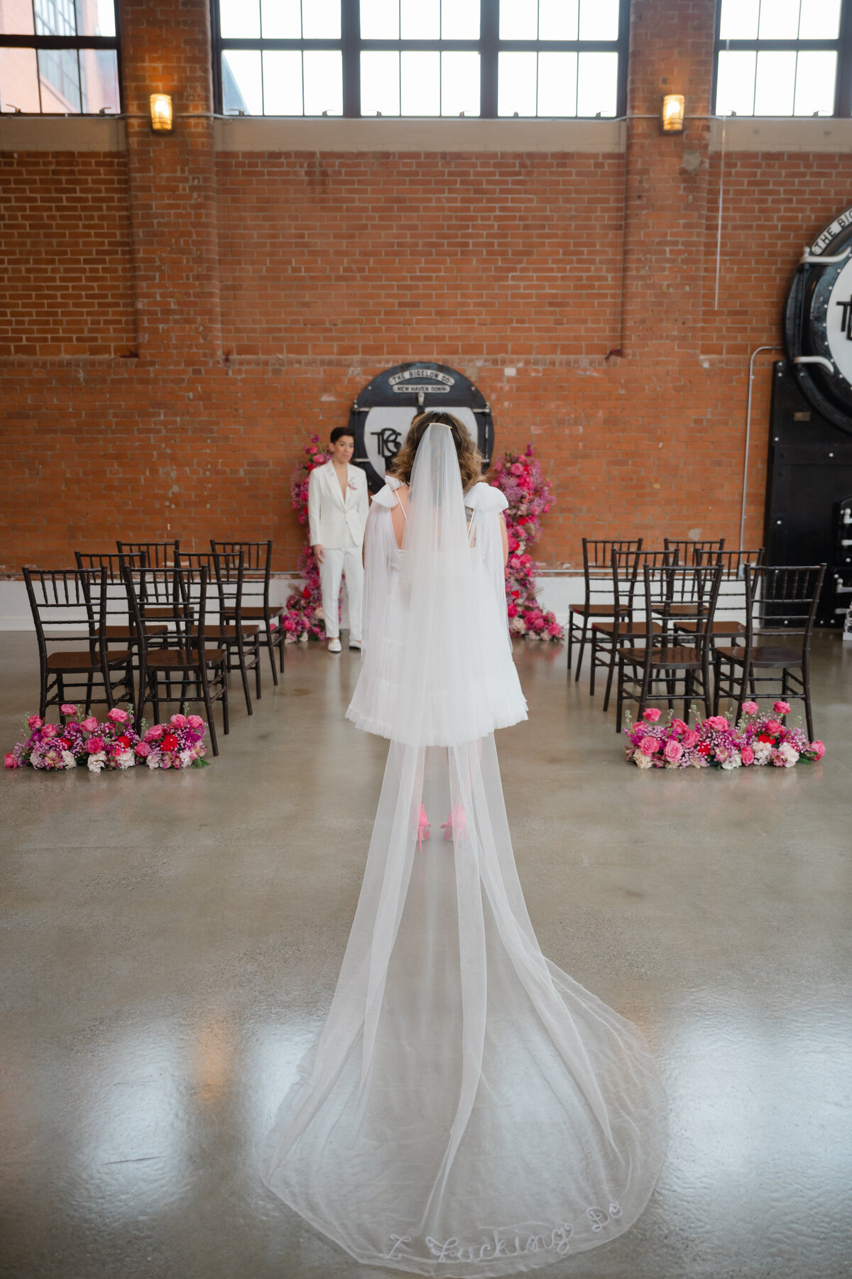 Long wedding veil down the wedding aisle