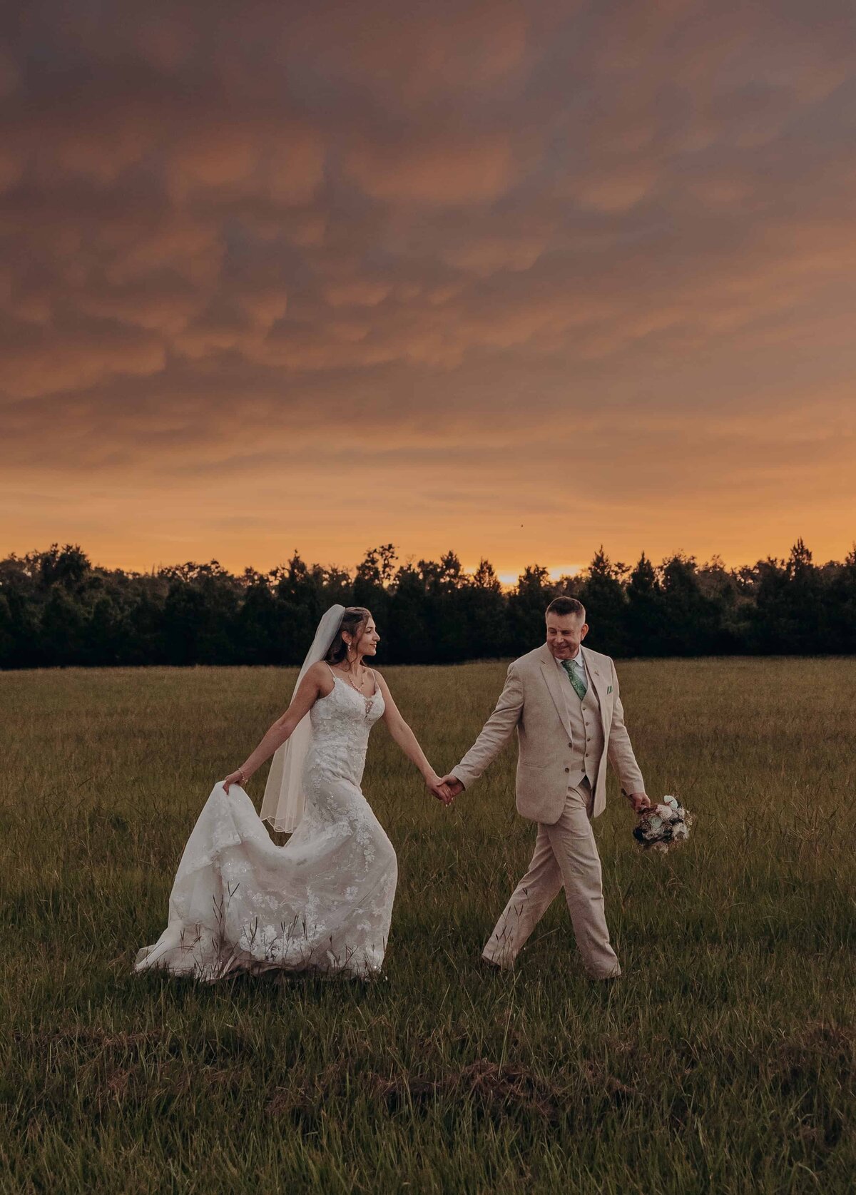 Bride and groom golden hour sunset portraits in the field at The Retreat, a Sarasota Wedding Venue in Florida.