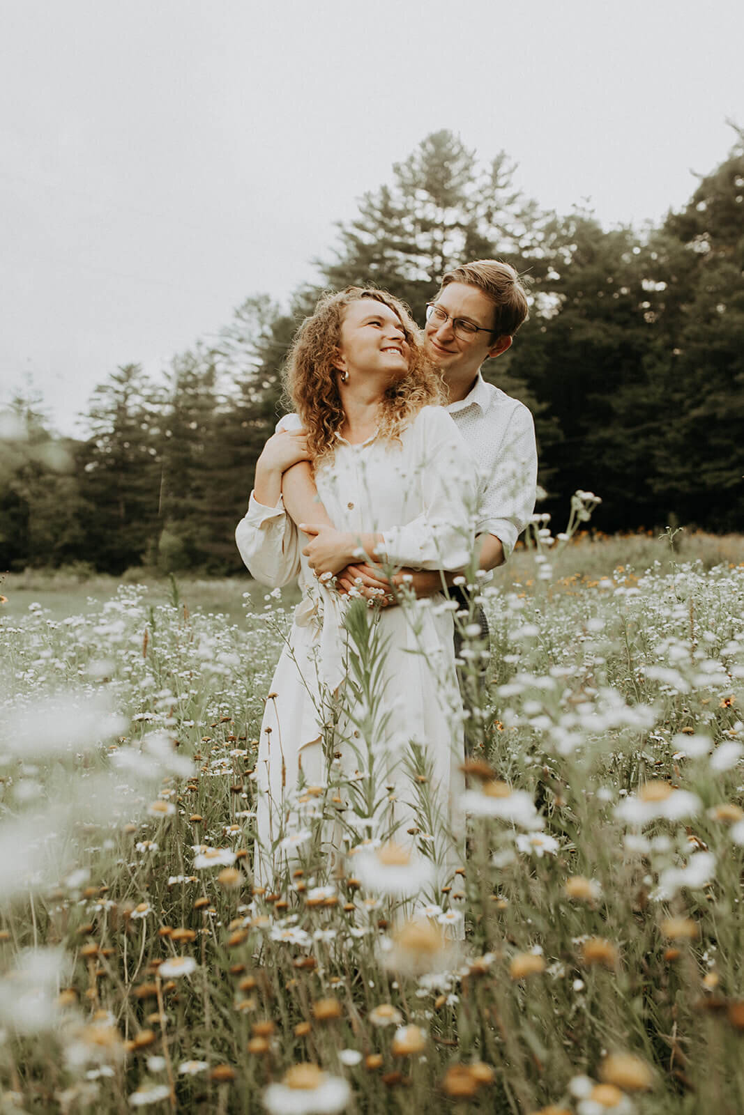 bride and groom in flower field