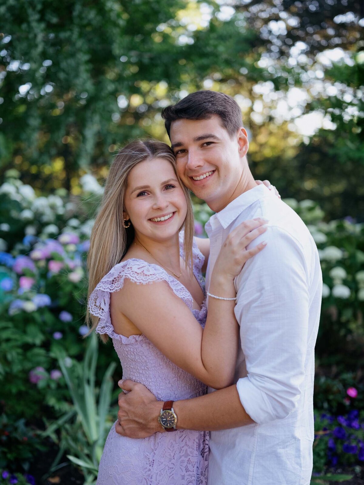 Couple sharing a romantic moment during their engagement session at Cleveland Cultural Gardens.