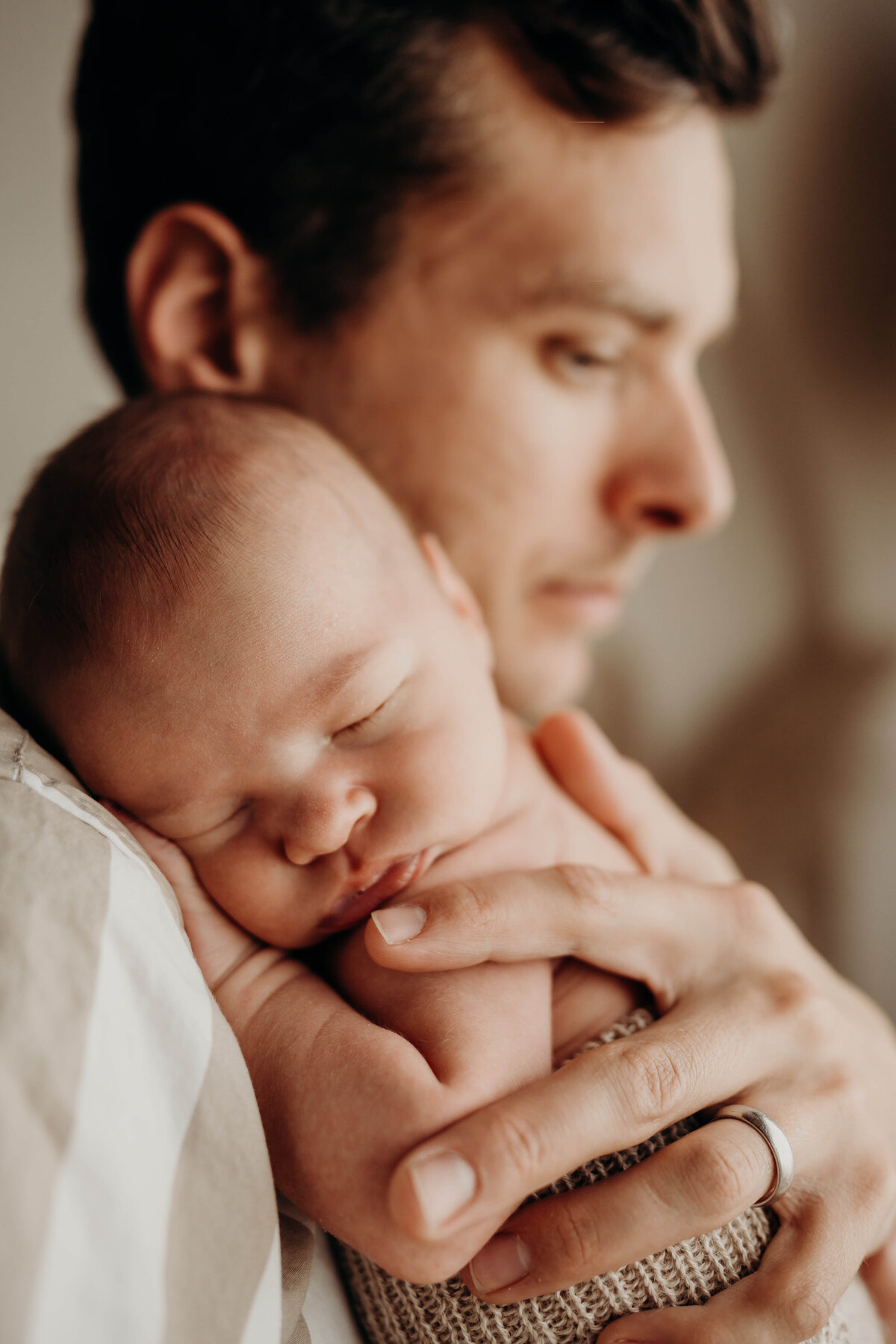 fine art close up portrait of newborn boy being held by his dad